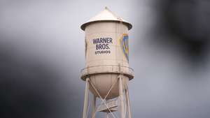 epa11040388 A branded water tower rises above Warner Bros. Studios in Burbank, California, USA, 21 December 2023. Warner Bros. Discovery Chief Executive David Zaslav met with Paramount Global CEO Bob Bakish on 19 December 2023 to discuss a merger of the companies, according to people familiar with the matter.  EPA/ALLISON DINNER
