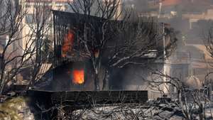 epa12198845 A house burns as a wildfire rages in the coastal region of Palaia Fokaia, some 40km southeast of Athens, Greece, 26 June 2025. Just after 12:30 p.m. on 26 June, a wildfire that ignited in low vegetation near Palaia Fokaia rapidly escalated, spreading over a wide area. Several homes have already been burned, and firefighting efforts are ongoing, with 90 firefighters on the ground supported by 28 fire engines, eight aircraft, and five helicopters.  EPA/GEORGE VITSARAS