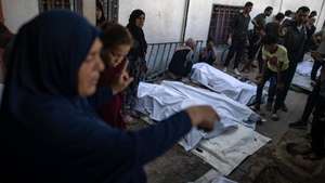 epa12206639 Palestinians bid farewell to relatives who were killed in an Israeli airstrike, at Al-Shifa Hospital in Gaza City, 30 June 2025. According to the Gaza Ministry of Health, 24 Palestinians were killed after the Israeli army targeted Al-Baqa Cafe located on the seafront of Gaza City.  EPA/HAITHAM IMAD