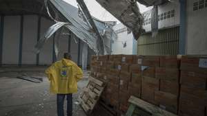 epa07447930 A handout photo made available by CARE, an international humanitarian agency shows a man checking the damages at the World Food Programm (WFP) warehouse, where the UN and NGO's store supplies damaged during the cyclone Idai landfall in Sofala Province, Central Mozambique, 16 March 2019. (Issued on 19 March 2019). A Category 4 Cyclone named Idai made land fall wreaking havoc knocking out power across the province and impacting every resident in Central Mozambique.  EPA/JOSH ESTEY / CARE / HANDOUT MANDATORY CREDIT: WWW.CARE.DE HANDOUT EDITORIAL USE ONLY/NO SALES