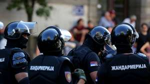 epa12209182 Riot police officers stand guard after removing a road blockade organized by students and anti-government demonstrators in Belgrade, Serbia, 01 July 2025. University students and anti-government protestors are demanding snap elections and release of detained protesters.  EPA/ANDREJ CUKIC