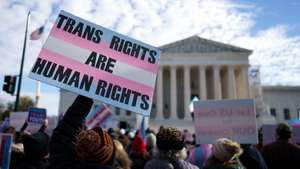 epa11756829 Transgender rights supporters rally outside the U.S. Supreme Court in Washington, DC, USA, 04 December 2024. The U.S. Supreme Court hears arguments in United States v. Skrmetti case on Tennessee's law banning gender-affirming care for minors.  EPA/WILL OLIVER