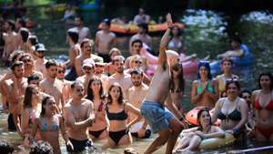 Attendees enjoy the opening day of the Paredes de Coura music festival in Paredes de Coura, northern Portugal, 13 August 2024. The festival runs through 16 August. ESTELA SILVA/LUSA