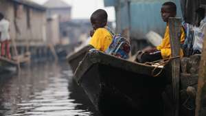 epa10434466 Students of Mawumadoka orphans and Less Privileged School are seen inside a canoe after classes outside the school built with Bamboo materials in the Makoko riverine community in Lagos, Nigeria 27 January 2023. The founder of the school which began in August 2018, Joshua moved from his from his small space to his mother's parlour with 78 orphans to render humanitarian services and provide free education, free feeding, clothings, and edunation materials to children of the poor and underprivileged in the community. The school had run on charitable gifts from some non-governmental organisations, including churches and other religious organisations.  EPA/Akintunde Akinleye