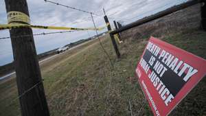 epa11104545 A protest sign against the death penalty is displayed outside of the W.C. Coleman Correction Facility where the State of Alabama is planning the execution of convicted killer Kenneth Eugene Smith in Atmore, Alabama, USA, 25 January 2024. There have been protests by several human rights groups who claim the experimental method of using nitrogen gas hypoxia to execute people may not work.  EPA/DAN ANDERSON