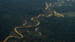 epa10444792 The dark waters of Mucajai river, due to the presence of illegal mining during a Brazilian Air Force mission to deliver supplies to the Yanomami people living on Indigenous Land near the Surucucu military base, in the Amazonian state of Roraima, Brazil, 02 February 2023. The mission departed from the Boa Vista Air Base, the state capital, in an Embraer KC-390 cargo plane. The Yanomami people are experiencing a humanitarian crisis due to the presence of illegal mining on their lands.  EPA/Raphael Alves