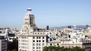epa11328410 A view of the former BBVA financial services company headquarters in Catalonia Square in Barcelona, Spain, 09 May 2024. BBVA has announced a hostile bid for Sabadell Bank after the first takeover offer was rejected by Sabadell. The Spanish government has announced its rejection to the hostile bid 'in form and in substance'.  EPA/Quique Garcia