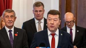 epa12500759 Freedom and Direct Democracy (SPD) party's chairman Tomio Okamura (2-R) talks to media after signing a new coalition government agreement with ANO (YES) movement's chairman Andrej Babis (L) and Motorists party's member Filip Turek (2-L) in Prague, Czech Republic, 03 November 2025. The parties have scheduled the signing ceremony for the first session of the new Chamber of Deputies. The parties plan to appoint a 16-member government, which will have a majority of 108 MPs in the lower house and be chaired by Andrej Babis.  EPA/MARTIN DIVISEK