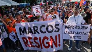 epa12528812 Protesters hold signs calling for the resignation of Philippine President Ferdinand 'Bongbong' Marcos Jr., during an anti-corruption rally in Quezon City, Metro Manila, Philippines, 16 November 2025. Ongoing investigations into government infrastructure programs, including flood control projects, have led various cause-oriented groups to hold mass demonstrations against corruption allegedly committed by low-level officials up to the highest ranked leaders in the country.  EPA/ROLEX DELA PENA