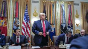 epa12565757 US President Donald J Trump (C) stands up to depart next to US Secretary of State Marco Rubio (L) and US Secretary of Defense Pete Hegseth (R) after holding a meeting with his Cabinet in the Cabinet Room of the White House in Washington, DC, USA, 02 December 2025.  EPA/YURI GRIPAS / POOL