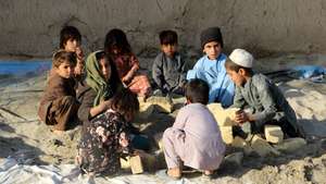 epa12542465 Afghani children play in Kandahar, Afghanistan, 22 November 2025. As winter closes in across Afghanistan, the hunger crisis is deepening: more than nine million people are facing food insecurity. International aid agencies are scaling back, with the World Food Programme able to reach only about one million people per month.  EPA/QUDRATULLAH RAZWAN