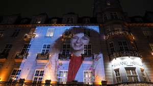 epa12587923 (FILE) - A picture of the 2023 Nobel Peace Prize winner Narges Mohammadi is projected on the facade of the Grand Hotel before the Nobel Banquet in Oslo, Norway, 10 December 2023 (reissued 12 December 2025). Narges Mohammadi, Nobel Peace Prize laureate in 2023, was arrested by security forces during a memorial ceremony for late lawyer Khosrow Alikordi, according to verified reports, citing the Narges Foundation.  EPA/Javad Parsa / POOL NORWAY OUT