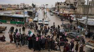 epa12655172 People celebrate the entry of Syrian army forces into the Deir Hafer area after the withdrawal of the Kurdish-led Syrian Democratic Forces (SDF), in Deir Hafer, eastern Aleppo countryside, Syria, 17 January 2026.  EPA/AHMAD FALLAHA