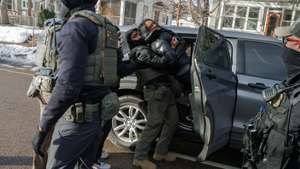 epa12647229 A woman screams as federal immigration enforcement agents shove her into their vehicle in Minneapolis, Minnesota, USA, 13 January 2026. As part of a federal immigration crackdown involving over 2,000 agents from Border Patrol, Immigration and Customs Enforcement (ICE), and Homeland Security Investigations (HSI), an ICE officer fatally shot US citizen Renee Nicole Good in her vehicle during an operation in South Minneapolis on 07 January 2026.  EPA/OLGA FEDOROVA