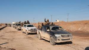 epa12663549 Syrian army soldiers patrol on their vehicle in the city of al-Shadadi, located in the countryside of al-Hasakah Governorate, northeastern Syria, 20 January 2026. The Syrian army has taken control of the city and its prison, and the Syrian Interior Ministry announced that it has arrested 81 of the 120 ISIS members who escaped from the prison.  EPA/MOHAMMED AL-RIFAI
