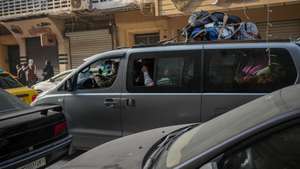 epa12634100 People ride a van as they flee Aleppo, Syria, 07 January 2026. Thousands of civilians evacuate the Sheikh Maqsoud and Ashrafieh neighborhoods after the Syrian army declared the districts a military zone. The move follows deadly clashes between the Syrian army and Kurdish-led Syrian Democratic Forces (SDF) that erupted on 06 January.  EPA/AHMAD FALLAHA