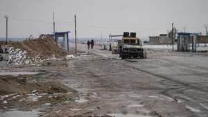 epa12675456 Destroyed vehicles on the side of the road as eements of the Syrian army deploy near the front lines with the Syrian Democratic Forces (SDF) 9 kilometres from the city of Al-Hasakah in northeastern Syria, 23 January 2026.  EPA/AHMAD FALLAHA