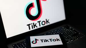 epa12674797 The TikTok logo displayed on a mobile phone and on a laptop screen in Liverpool, Britain, 23 January 2026. A proposal to ban under-16s from accessing social media in the UK will be considered in the House of Commons after peers in the House of Lords voted 261 to 150 in favour of an amendment to the Children’s Wellbeing and Schools Bill. If adopted, the amendment would require social media companies to implement strict and effective age checks in order to prevent underage users from signing up.  EPA/ADAM VAUGHAN