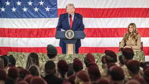 epa12736458 US President Donald Trump, with First Lady Melania Trump, delivers remarks to service members and their families at Fort Bragg, North Carolina, USA, 13 February 2026. Trump met with US special forces members involved in the capture of former Venezuelan President Nicolas Maduro in early January.  EPA/STAN GILLILAND