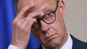 epa12726580 German Chancellor Friedrich Merz looks on during the presentation of the annual report of the Commission of Experts for Research and Innovation (Expertenkommission Forschung und Innovation, EFI) at the Chancellery in Berlin, Germany, 11 February 2026.  EPA/CLEMENS BILAN