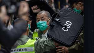 epa12718873 (FILE) - Media mogul and Honk Kong Apple Daily founder Jimmy Lai (C) is escorted out of a Correctional Services Department vehicle and into the Court of Final Appeal in Hong Kong, China, 09 February 2021 (reissued 09 February 2026). A court in Hong Kong sentenced 78-year-old media tycoon and pro-democracy advocate Jimmy Lai, who holds British citizenship, to 20 years in prison for national securites offenses and sedition. Lai denies all charges.  EPA/JEROME FAVRE