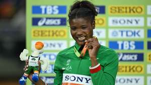 epa12841640 Gold medalist Agate de Sousa of Portugal celebrates on the podium of the Women's long jump at the World Athletics Indoor Championships at the Kujawsko-Pomorska Arena Torun, in Torun, Poland, 22 March 2026.  EPA/Adam Warzawa POLAND OUT