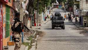 epaselect epa12714792 A member of the police guards an area in Port-au-Prince, Haiti, 07 February 2026. Prime Minister Alix Didier Fils-Aime said he was aware of the responsibilities he assumes as he takes executive power and pledged to get to work immediately.  EPA/Mentor David Lorens