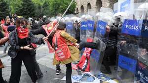 epa11311990 Protesters clash with riot police as they attempt to reach Taksim Square to celebrate the International Labor Day in Istanbul, Turkey, 01 May 2024. Thousands of protesters, including members of the main labor unions and leftist groups, gathered for a rally to reach Istanbul's Taksim Square as Turkish police sealed off the central square to prevent May Day demonstrations. The security measures came a day after Interior Minister Yerlikaya said authorities had designated 40 areas for May Day celebrations, excluding Taksim Square.  EPA/TOLGA BOZOGLU