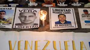 epa12942773 A photograph shows posters of political prisoners during a vigil in support of the late Víctor Hugo Quero, who died last year while in state custody, organized by relatives of detainees, in Caracas, Venezuela, 08 May 2026.  EPA/Ronald Pena R