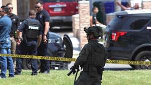 epa12972655 Law enforcement personnel gather on the scene to respond to an active shooting incident at the Islamic Center of San Diego, located in the Clairemont neighborhood in San Diego, California, USA, 18 May 2026.  Police agencies from across San Diego County responded to an active shooter incident at the Islamic Center of San Diego in the Clairemont neighborhood. Three people were killed, including a security guard.  EPA/JOHN GASTALDO