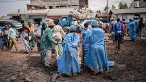 epaselect epa12997437 Health workers in protective gowns and masks operate at a checkpoint set up for preventive measures against Ebola in Kanyaruchinya, near Goma, North Kivu, Democratic Republic of Congo, 27 May 2026. The World Health Organization (WHO) has declared the Ebola outbreak, caused by the Bundibugyo virus, in the Democratic Republic of the Congo a public health emergency of international concern.  EPA/MARIE JEANNE MUNYERENKANA