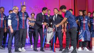 epa13007162 French President Emmanuel Macron (C-R) poses with PSG head coach Luis Enrique (2-L), president Nasser Al-Khelaifi (C-L) and PSG captain Marquinhos (C-R) with the trophy during a reception for the PSG team staff and players at the Elysee Palace in Paris, France, 31 May 2026. Paris Saint-Germain won the UEFA Champions League for the second time after beating Arsenal FC on 30 May 2026 in the final in Budapest.  EPA/CHRISTOPHE PETIT TESSON / POOL