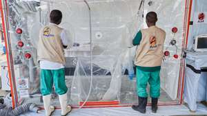 epa13052882 Staff members work in an Ebola treatment center run by the NGO Alliance for Medical Action (ALIMA) in Rwampara, Ituri, Democratic Republic of Congo, 20 June 2026. On 19 June, the World Health Organization (WHO) said the Ebola outbreak in the eastern Democratic Republic of Congo was 'evolving so fast.'  EPA/DIEUDONNE DIROLE