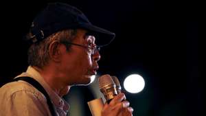 epa08465303 Lam Wing Kee, a former Hong Kong publisher speaks to the crowd as he join a vigil during the Commemoration of the 31th anniversary of the 1989 Tiananmen Massacre, in Taipei, Taiwan, 04 June 2020. In the early hours of 04 June 1989, Chinese troops cracked down on student protesters at Tiananmen Square in Beijing, leaving many students killed or injured.  EPA/RITCHIE B. TONGO