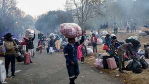 epa13074516 Malawian refugees gather outside the Embassy of Malawi while waiting to board buses back to their home country ahead of a nationwide anti-immigrant movement shutdown in Johannesburg, South Africa, 30 June 2026. A nationwide anti-migrant movement shutdown is set for 30 June, in line with a deadline requiring all immigrants to leave South Africa by the same date. Marches are planned across South Africa as a large number of organizations under the umbrella of the 'March and March movement' take to the streets of South Africa’s major cities to protest against the high number of legal and illegal immigrants living in the country.  EPA/KIM LUDBROOK