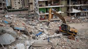 epa13089622 Rescue staff work at a building brought down by the double earthquake in Catia La Mar, Venezuela, 05 July 2026. Eleven days after the double earthquake struck the country, efforts are focused on clearing debris from collapsed buildings in La Guaira state, while search and rescue operations scale back. The two earthquakes of magnitude 7.2 and 7.5 struck Venezuela on 24 June 2026.  EPA/Ronald Pena R
