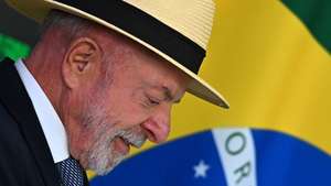 epa13127392 Brazilian President Luiz Inacio Lula da Silva participates in the signing ceremony for the Conversion Bill, which allocates funds to the credit lines of the 'Brasil Soberano' program to support companies affected by US trade tariffs, at the Planalto Palace in Brasilia, Brazil, 22 July 2026.  EPA/Andre Borges