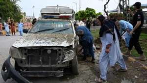 epa13146980 Security officials inspect the site of a roadside IED blast that targeted a police vehicle in Peshawar, Pakistan, 02 August 2026. Two police personnel suffered minor injuries when an improvised explosive device (IED) exploded near a police van close to the Peshawar-Islamabad motorway toll plaza near Pir Zakorhi Bridge. The attack came amid a recent surge in militant violence across Khyber Pakhtunkhwa targeting security forces.  EPA/BILAWAL ARBAB