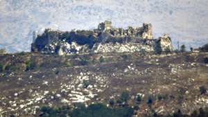 epa13144693 Damage and destroyed terrain in the area surrounding Belfort Castle, as seen from Zawtar al-Gharbiyah, Nabatieh Governorate, southern Lebanon, 31 July 2026, following a US-brokered security agreement between Lebanon and Israel. Crews returned to the town to conduct cleanup operations and evaluate structural damage after the area was designated as one of the initial 'pilot zones' for Lebanese Armed Forces deployment and phased Israeli military withdrawal.  EPA/STRINGER -- BEST QUALITY AVAILABLE --