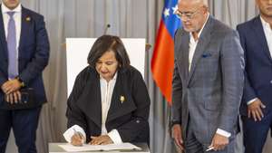 epa13165693 Dinorah Figuera (2-L), former president of the Venezuelan National Assembly in 2015, and National Assembly President Jorge Rodriguez (2-R) sign a document during the final session of the dialogue table in Caracas, Venezuela, 12 August 2026. Representatives of Venezuela's government and opposition agreed to replace all magistrates of the Supreme Court of Justice (TSJ) as part of the first agreements reached in US-backed talks aimed at a political transition.  EPA/MIGUEL GUTIERREZ