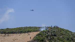 epa13171653 Sub-Saharan African and Sudanese migrants gather near Fnideq (Castillejos), Morocco, as they attempt to enter the Spanish city of Ceuta, 15 August 2026. Moroccan security sources said the attempted crossings took place in a mountainous area on the outskirts of Castillejos, southwest of Ceuta.  EPA/JALAL MORCHIDI