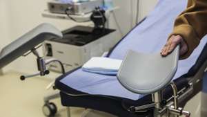 epa11830843 A woman clutches one of the leg rests of a chair where surgical abortions are performed at La Maison des femmes, (The Womens house) a care center for women in difficulty or victims of violence, in Saint Denis, Paris suburbs, France, 17 January 2025. Created in July 2016 by gynecologist Ghada Hatem, the Maison des femmes is a unit of the Saint-Denis hospital that offers support to women in difficulty or victims of violence. Forty years ago, on 17 January 1975, France decriminalized abortion through the Veil Law.  EPA/TERESA SUAREZ