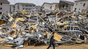 epaselect epa13180936 A man walks past the rubble of homes damaged by earthquakes in Catia La Mar, Venezuela, 17 August 2026 (issued 20 August 2026). Amid the ruins of buildings and the passage of machinery clearing away the rubble, nearly two months after the earthquakes of June 24, daily life has found its way back among hundreds of tents in the Venezuelan state of La Guaira, where precarious conditions and resilience prevail.  EPA/Miguel Gutierrez