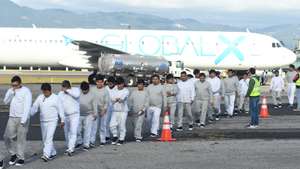 epa12618705 People walk at the Guatemalan Air Force base after arriving on the last deportation flight of the year from the United States, in Guatemala City, Guatemala, 30 December 2025.  EPA/ALEX CRUZ