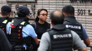 epaselect epa13182054 Chan Kim-kam (C), owner of the pro-democracy shop Heung Together, arrives at the West Kowloon Law Courts Building in Hong Kong, China, 21 August 2026. Chow Hang-tung and Lee Cheuk-yan are expected to receive a verdict on charges of inciting subversion under the national security law over their roles in the now-disbanded Hong Kong Alliance in Support of Patriotic Democratic Movements of China, which organized annual vigils commemorating the 1989 Tiananmen crackdown.  EPA/MAY JAMES