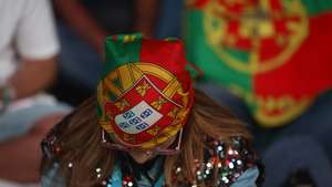 Adeptos da seleção nacional de futebol reagem durante o jogo do Mundial de Futebol entre Portugal e a Colômbia, no Rock in Rio, no Parque das Nações, em Lisboa, 28 de junho de 2026. ANTÓNIO PEDRO SANTOS/LUSA