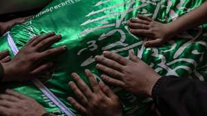 epaselect epa12963492 Palestinian relatives mourn over the body of Izz al-Din al-Haddad, the commander of the Al-Qassam Brigades, during his funeral procession in Gaza City, 16 May 2026. Hamas military wing's commander al-Haddad was killed alongside his wife and daughter in an Israeli airstrike in Gaza City on 15 May 2026. The strike resulted in the deaths of at least eight Palestinians and left dozens of others injured.  EPA/MOHAMMED SABER