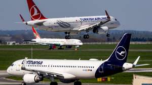 epa12909218 A Lufthansa Airbus A320 airplane waits for takeoff on the tarmac as a Turkish Airlines Airbus A320 airplane lands at Vaclav Havel Airport in Prague, Czech Republic, 23 April 2026. Global airlines face surging jet fuel costs amid escalating tensions in the Middle East. The volatile situation is tightening supply and pushing kerosene (Jet A-1) prices to record levels.  EPA/MARTIN DIVISEK