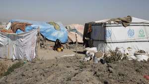 epa10353995 A displaced Yemeni woman sits by makeshift shelters at a camp for Internally Displaced Persons (IDPs) on the outskirts of Sana'a, Yemen, 05 December 2022 (issued 07 December 2022). More than 4.3 million people are estimated to have been internally displaced in war-ravaged Yemen, including 53,376 people who are newly displaced in 2022, according to the United Nations High Commissioner for Refugees (UNHCR). Most of them are in need of humanitarian aid for their day-to-day needs to survive. About 40 percent of the displaced are living in unofficial displacement camps and do not have adequate access to basic services. Yemen is in its eighth year of war since the Houthis took over the capital Sana'a and the northern parts of the Arab country and then the Saudi-led military coalition intervened in Yemen's conflict to restore the government.  EPA/YAHYA ARHAB