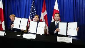 epaselect epa13255930 (L-R) US President Donald Trump, Denmark's Prime Minister Mette Frederiksen and Greenland's Prime Minister Jens-Frederik Nielsen show signed documents during the signing ceremony for a trilateral Arctic security agreement between the United States, Denmark, and Greenland at the UN Headquarters in New York, New York, USA, 22 September 2026, on the sidelines of the United Nations General Assembly (UNGA).  EPA/MADS CLAUS RASMUSSEN DENMARK OUT